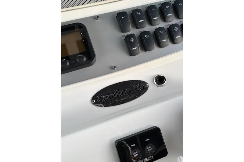 Slide: The Image of 2019 Chris-Craft Catalina 26 dashboard with control panel and nameplate. - 6