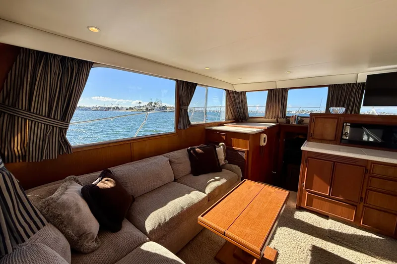 Slide: The Image of Luxurious interior of 1985 Chris-Craft 382 Commander yacht with scenic ocean view. - 11