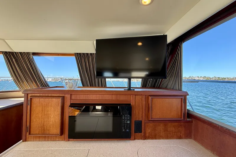 Slide: The Image of Interior of 1985 Chris-Craft 382 Commander with TV, microwave, and ocean view. - 15