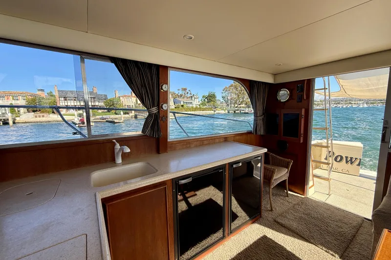 Slide: The Image of Interior of 1985 Chris-Craft 382 Commander yacht with waterfront view. - 16