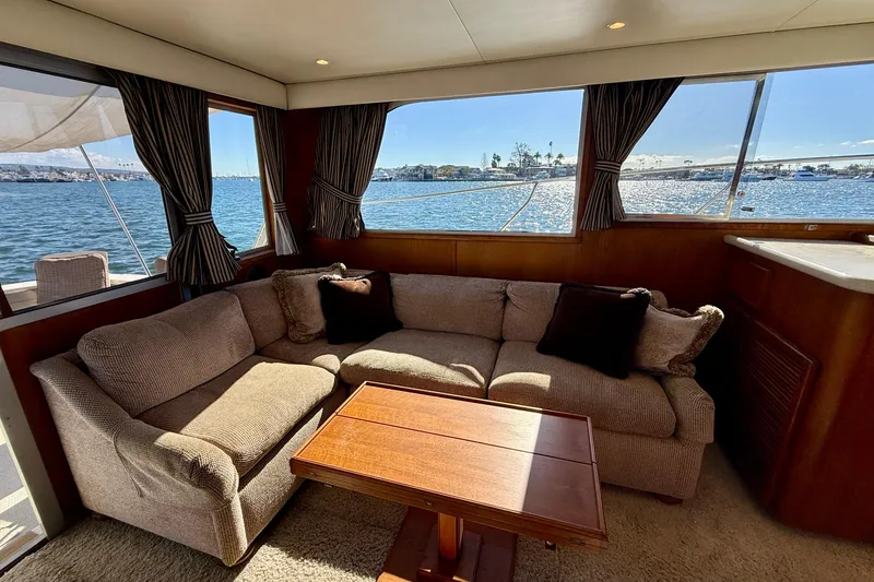 Slide: The Image of Interior of 1985 Chris-Craft 382 Commander yacht with cozy seating and scenic water view. - 19