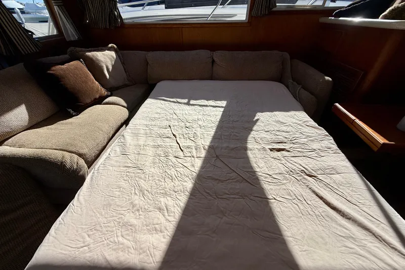 Slide: The Image of Interior of 1985 Chris-Craft 382 Commander with sofa bed and cushions. - 20