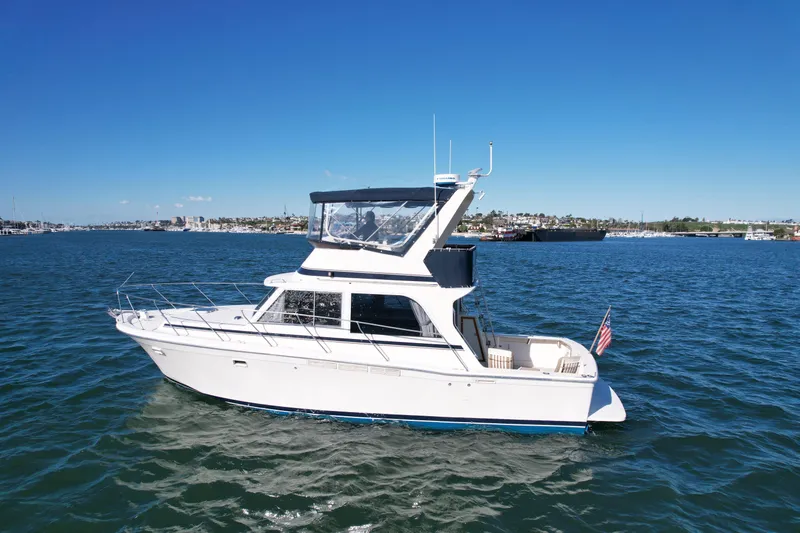 Slide: The Image of 1985 Chris-Craft 382 Commander yacht cruising on a sunny day in open waters. - 3