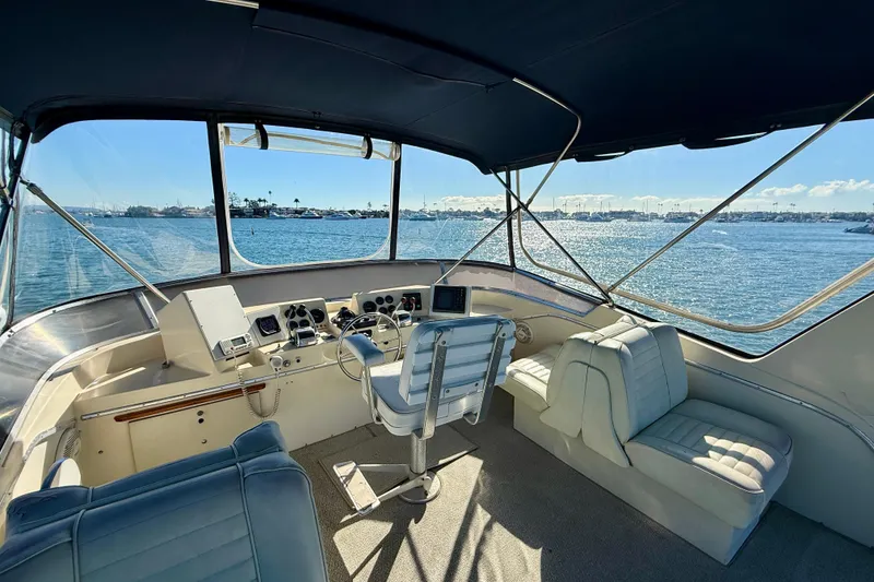Slide: The Image of Interior view of 1985 Chris-Craft 382 Commander yacht, featuring helm and seating area. - 45