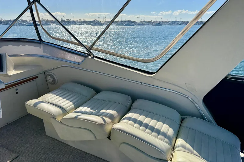 Slide: The Image of 1985 Chris-Craft 382 Commander interior with plush seating and ocean view. - 46