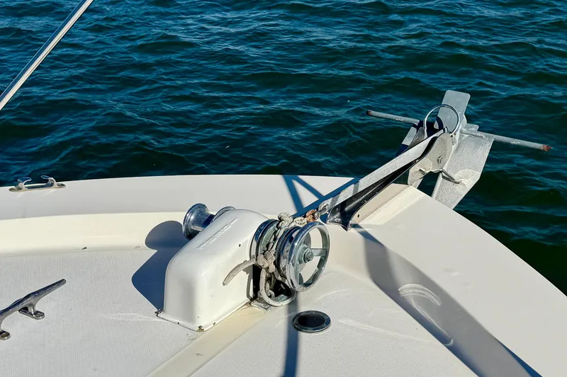 Slide: The Image of 1985 Chris-Craft 382 Commander boat anchor and winch system on calm water. - 49