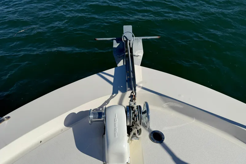Slide: The Image of Bow of 1985 Chris-Craft 382 Commander with anchor and winch over water. - 50