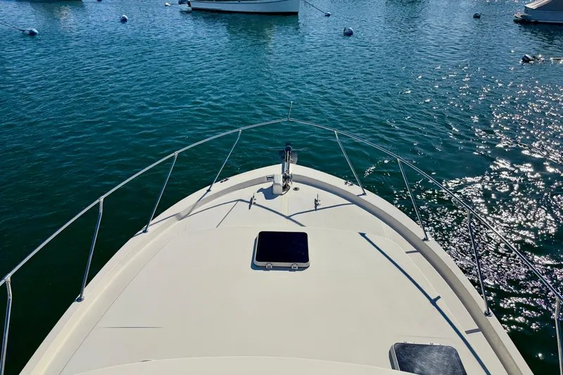 Slide: The Image of Bow view of 1985 Chris-Craft 382 Commander on sparkling water. - 52