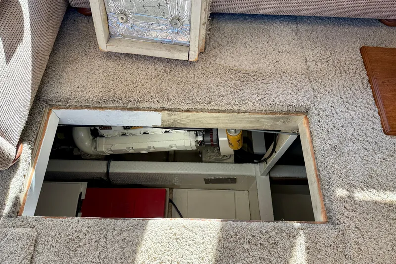 Slide: The Image of Engine compartment of 1985 Chris-Craft 382 Commander, accessed through carpeted floor panel. - 53