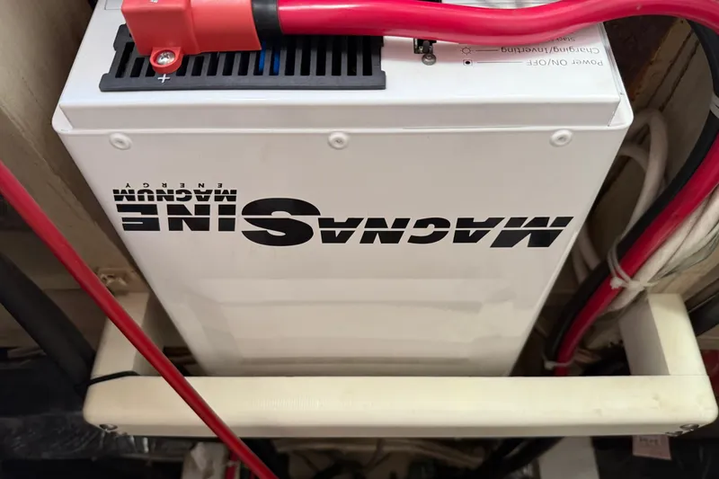 Slide: The Image of Magnum Energy inverter in 1985 Chris-Craft 382 Commander boat, with red cables connected. - 57