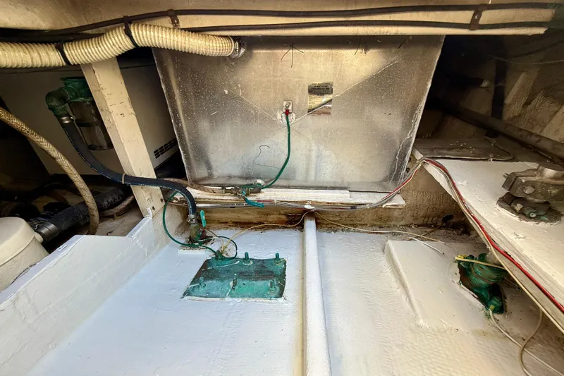 Slide: The Image of Engine compartment of a 1985 Chris-Craft 382 Commander boat, showing wiring and components. - 61