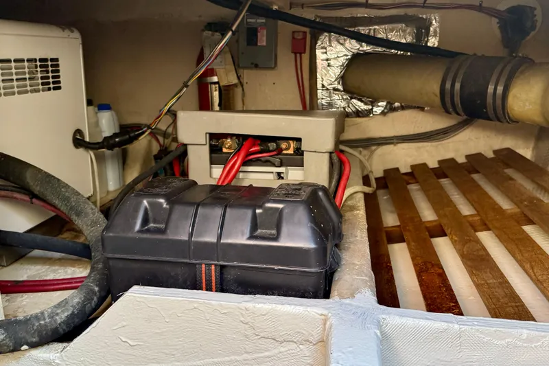 Slide: The Image of Engine room of 1985 Chris-Craft 382 Commander with battery and wiring components. - 62