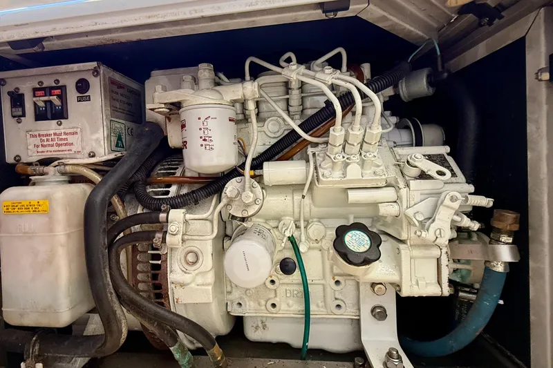 Slide: The Image of Engine compartment of a 1985 Chris-Craft 382 Commander boat, showcasing mechanical components. - 63