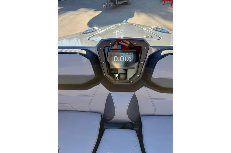 Slide: The Image of 2026 Sunsation 32CCX boat dashboard with digital display and sleek design. - 14