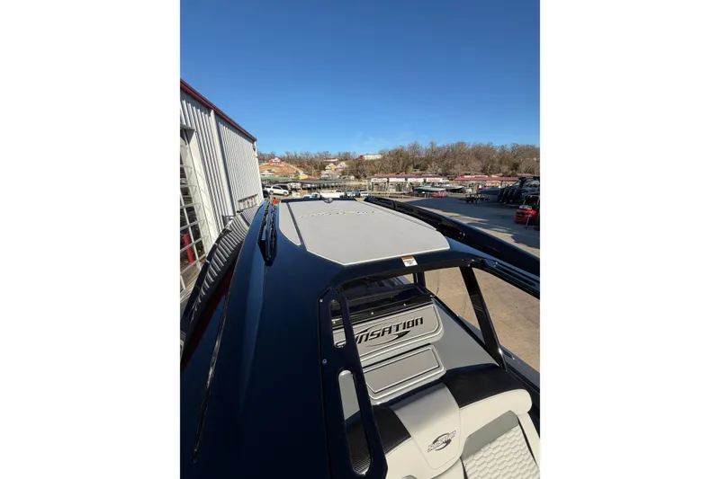 Slide: The Image of 2026 Sunsation 32CCX boat docked, showcasing sleek design and modern features. - 19