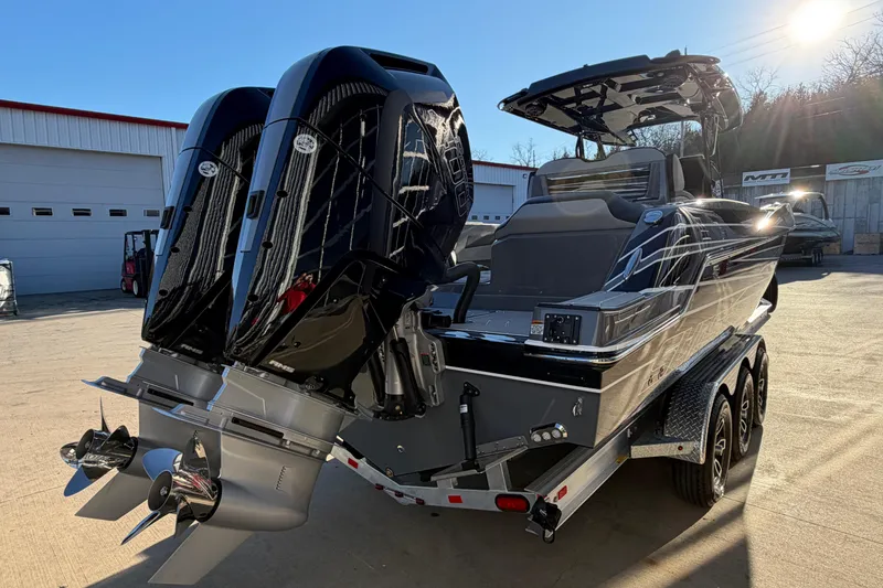 Slide: The Image of 2026 Sunsation 32CCX boat with dual engines on a trailer in a sunny outdoor setting. - 5