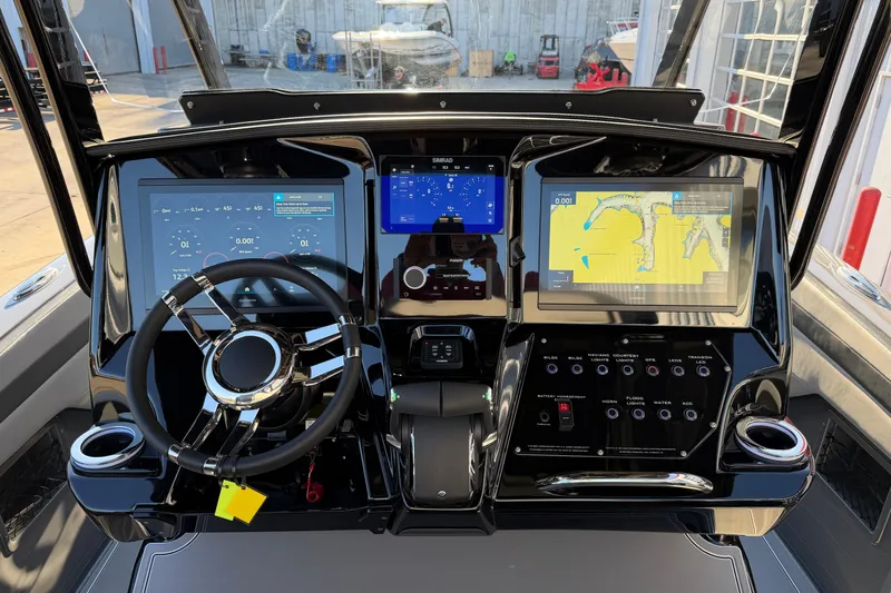 Slide: The Image of 2026 Sunsation 32CCX boat dashboard with advanced navigation and control systems. - 8