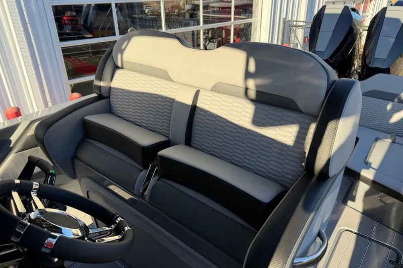 Slide: The Image of 2026 Sunsation 32CCX boat interior with luxurious seating and modern steering wheel design. - 9