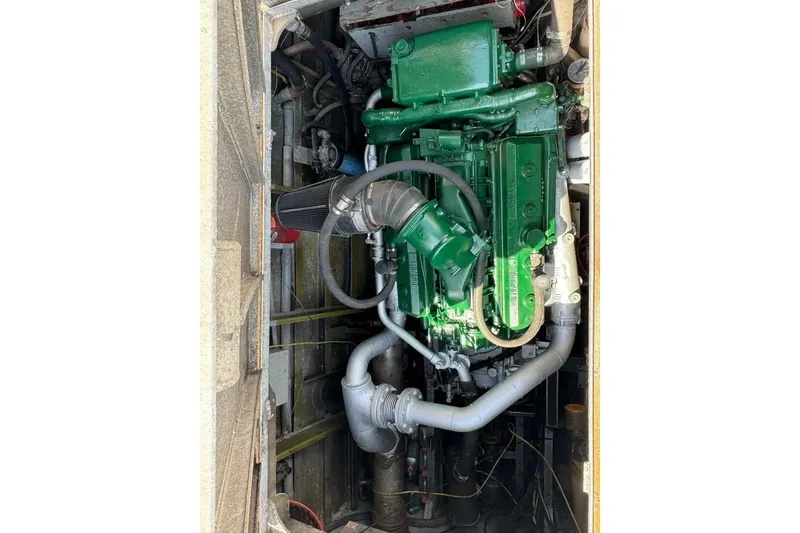 Slide: The Image of Green engine in a 1964 custom commercial vehicle, showcasing intricate piping and components. - 4