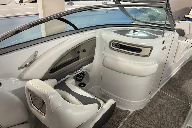 Slide: The Image of 2017 Crownline 275 SS boat interior with sleek seating and modern dashboard design. - 11