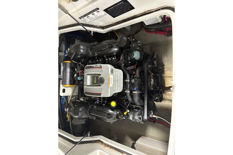 Slide: The Image of Engine compartment of a 2017 Crownline 275 SS boat, showcasing detailed mechanical components. - 13