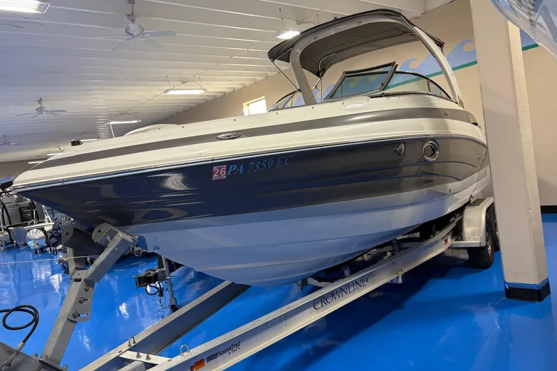 Slide: The Image of 2017 Crownline 275 SS boat on trailer in indoor showroom. - 3