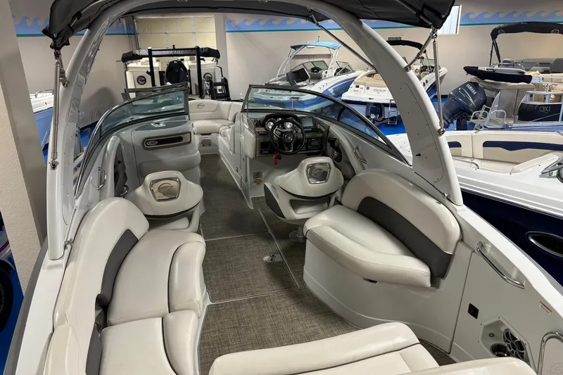 Slide: The Image of 2017 Crownline 275 SS boat interior with luxurious seating and modern dashboard. - 4
