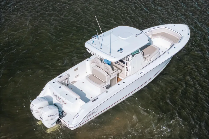 Slide: The Image of 2019 Boston Whaler 330 Outrage boat on water, aerial view. - 22