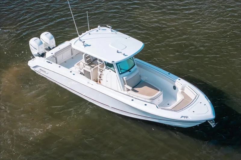Slide: The Image of 2019 Boston Whaler 330 Outrage boat on water, aerial view. - 23
