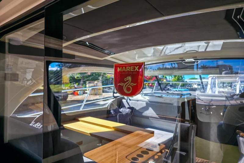 Slide: The Image of Luxurious interior of 2026 Marex 330 Scandinavia yacht with elegant seating and wooden table. - 14