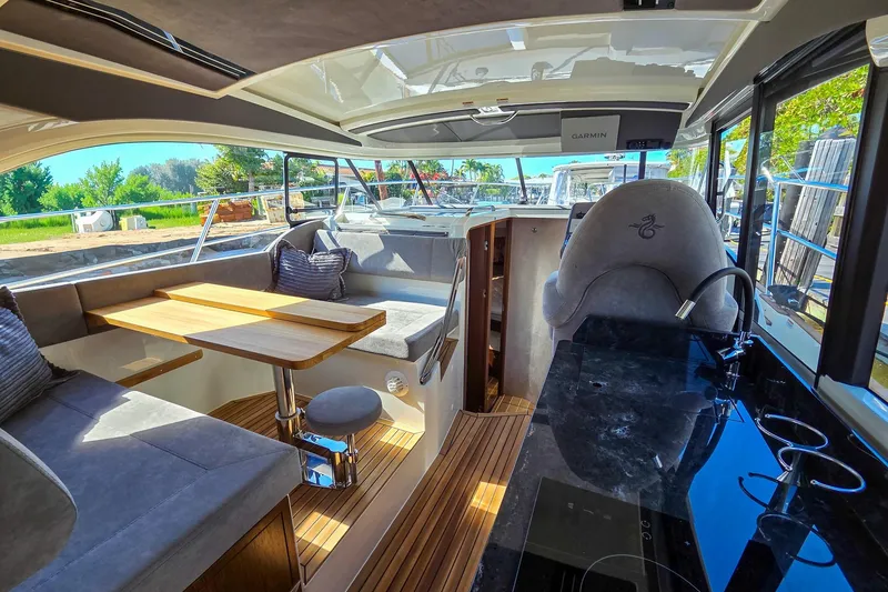 Slide: The Image of Interior of 2026 Marex 330 Scandinavia yacht with elegant seating and wooden flooring. - 15