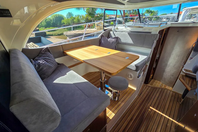 Slide: The Image of 2026 Marex 330 Scandinavia interior with cozy seating and wooden table, showcasing modern design. - 19