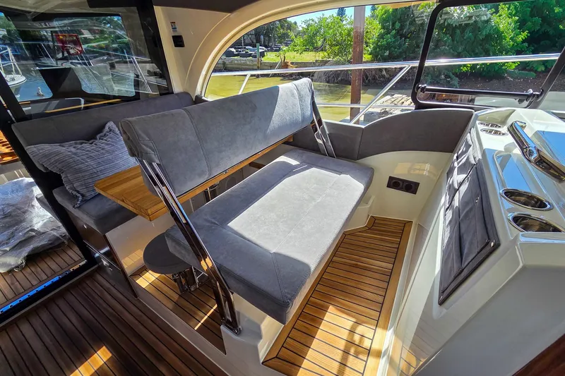 Slide: The Image of Interior of 2026 Marex 330 Scandinavia yacht with sleek seating and wooden flooring. - 20