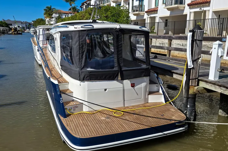 Slide: The Image of 2026 Marex 330 Scandinavia yacht docked in a scenic marina setting. - 3