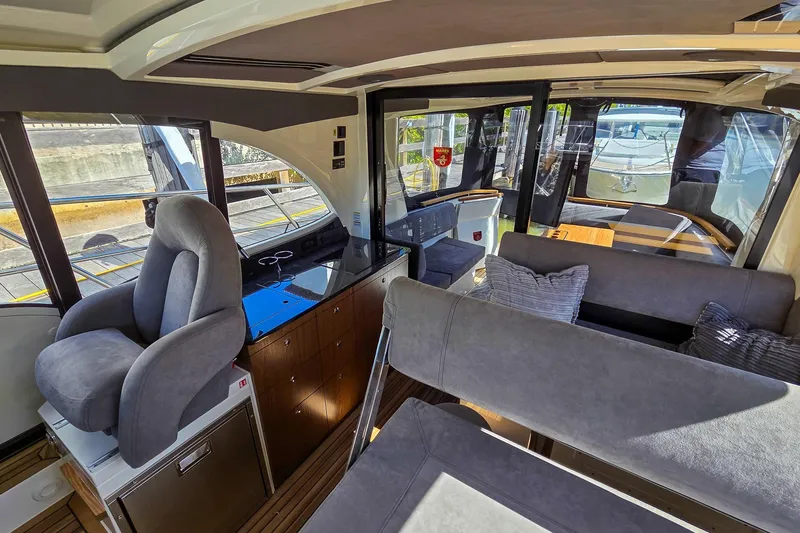 Slide: The Image of Interior of 2026 Marex 330 Scandinavia yacht, featuring plush seating and modern design. - 32