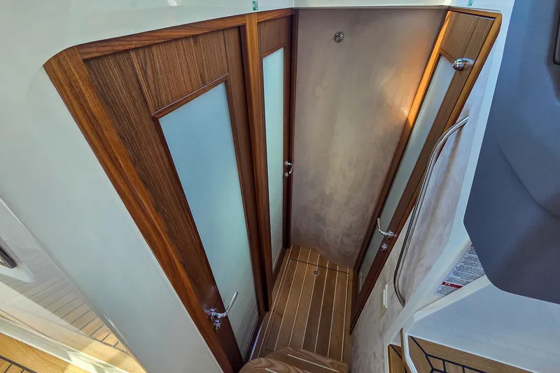 Slide: The Image of Interior of 2026 Marex 330 Scandinavia, featuring wooden doors and flooring. - 21