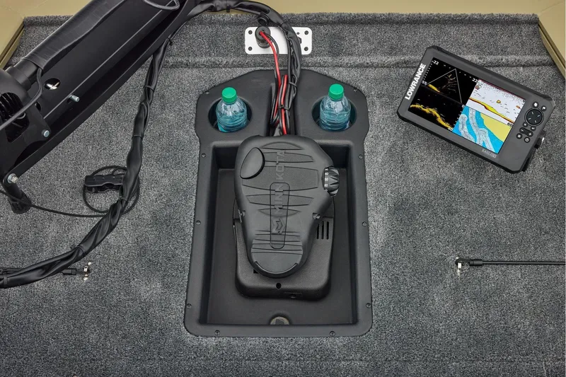 Slide: The Image of Manufacturer Provided Image: 2026 Tracker Pro Team 195 boat interior with navigation system and water bottles. - 21