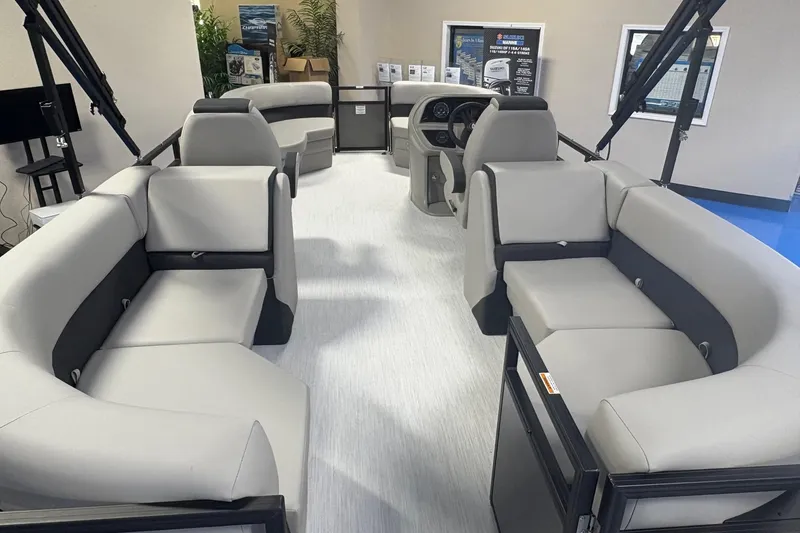 Slide: The Image of Interior view of 2026 Dockside 22DQ boat with modern seating and steering console. - 11