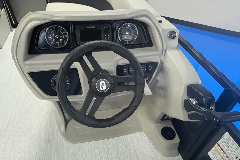 Slide: The Image of 2026 Dockside 22DQ boat dashboard with steering wheel and control panel. - 7