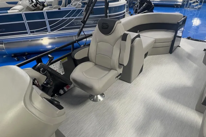 Slide: The Image of Interior of 2026 Dockside 22DQ boat with modern seating and steering console. - 8