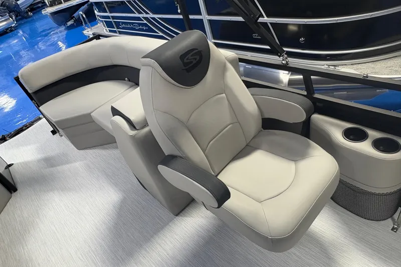Slide: The Image of Luxurious seating on Dockside 22DQ boat, 2026 model, featuring plush captain's chair and sofa. - 9