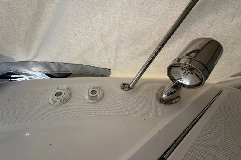 Slide: The Image of 2014 Sea Ray 370 Sundancer deck with chrome light fixture and fittings. - 10