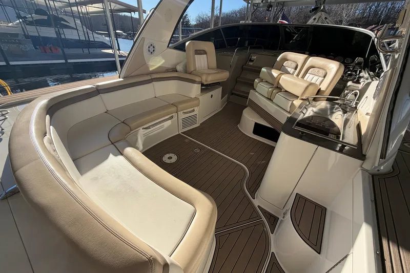 Slide: The Image of Luxurious 2014 Sea Ray 370 Sundancer yacht interior with plush seating and elegant design. - 18