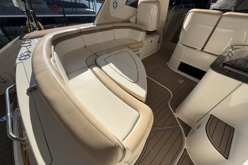 Slide: The Image of Luxurious interior of 2014 Sea Ray 370 Sundancer yacht with elegant seating and wood flooring. - 21