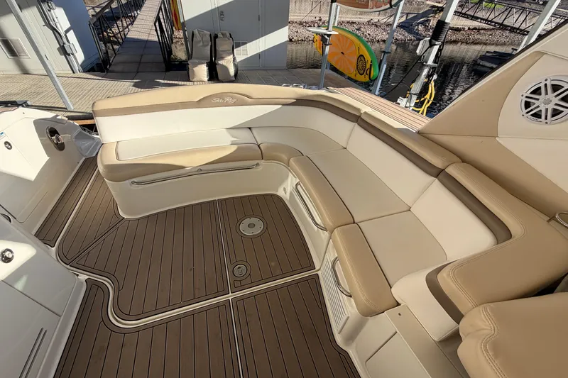 Slide: The Image of Luxurious seating area on a 2014 Sea Ray 370 Sundancer boat with teak flooring. - 25