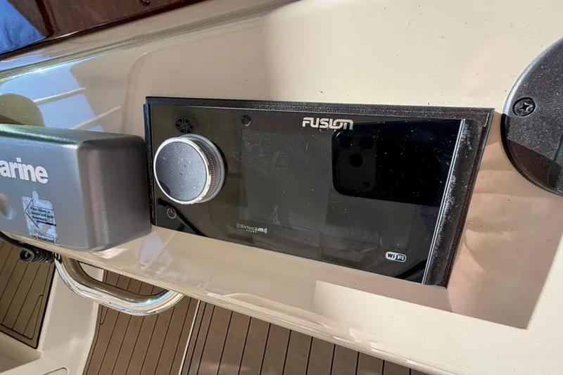 Slide: The Image of Fusion audio system on 2014 Sea Ray 370 Sundancer boat dashboard. - 41