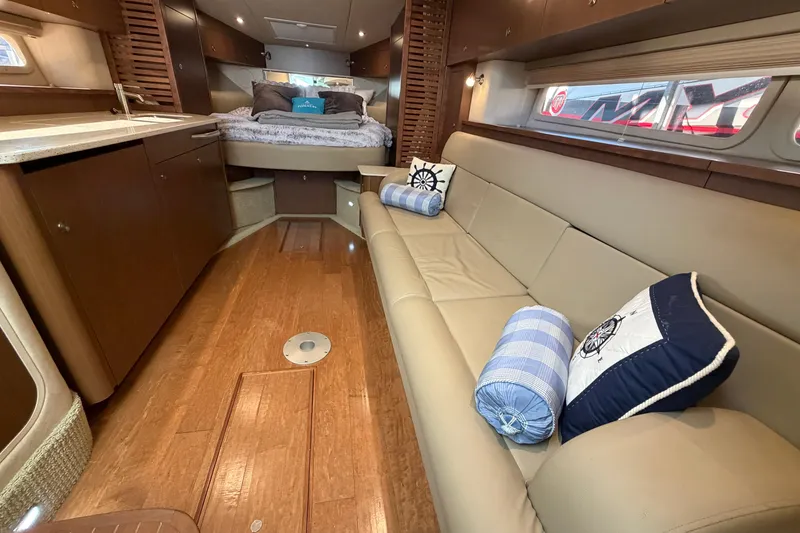Slide: The Image of Luxurious interior of 2014 Sea Ray 370 Sundancer yacht with cozy seating and elegant decor. - 45