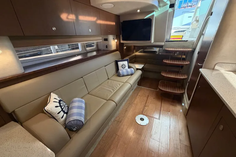 Slide: The Image of Luxurious interior of 2014 Sea Ray 370 Sundancer yacht with plush seating and modern amenities. - 48