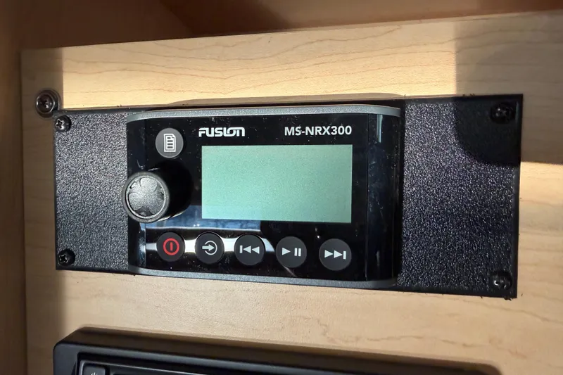 Slide: The Image of Fusion MS-NRX300 stereo system on 2014 Sea Ray 370 Sundancer boat dashboard. - 56