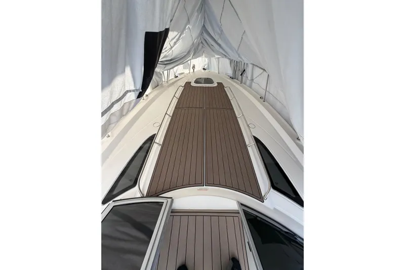 Slide: The Image of 2014 Sea Ray 370 Sundancer boat deck under protective cover. - 6